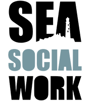 Sea Social Work Logo. The words Sea, Social and Work are stacked on top of each other. 'Sea' and 'Work' are black, 'Social' is a dull green/grey. 'Sea' has a lighthouse skyline incorporated into it.